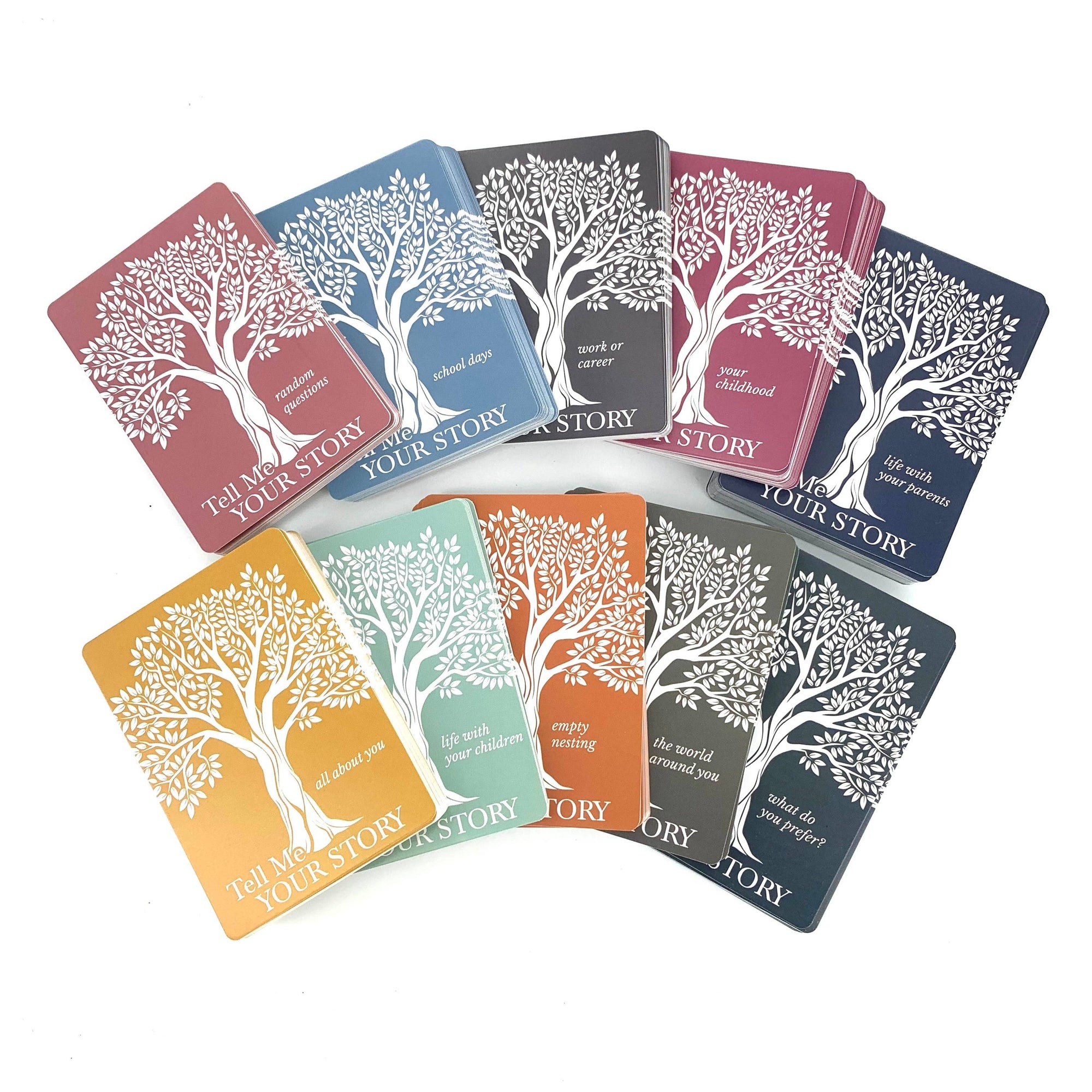 Set of colorful books with tree designs and text on a white background